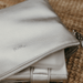 Packed in a spacious metallic silver nappy wallet is a matching fold-up change mat and wipes case.